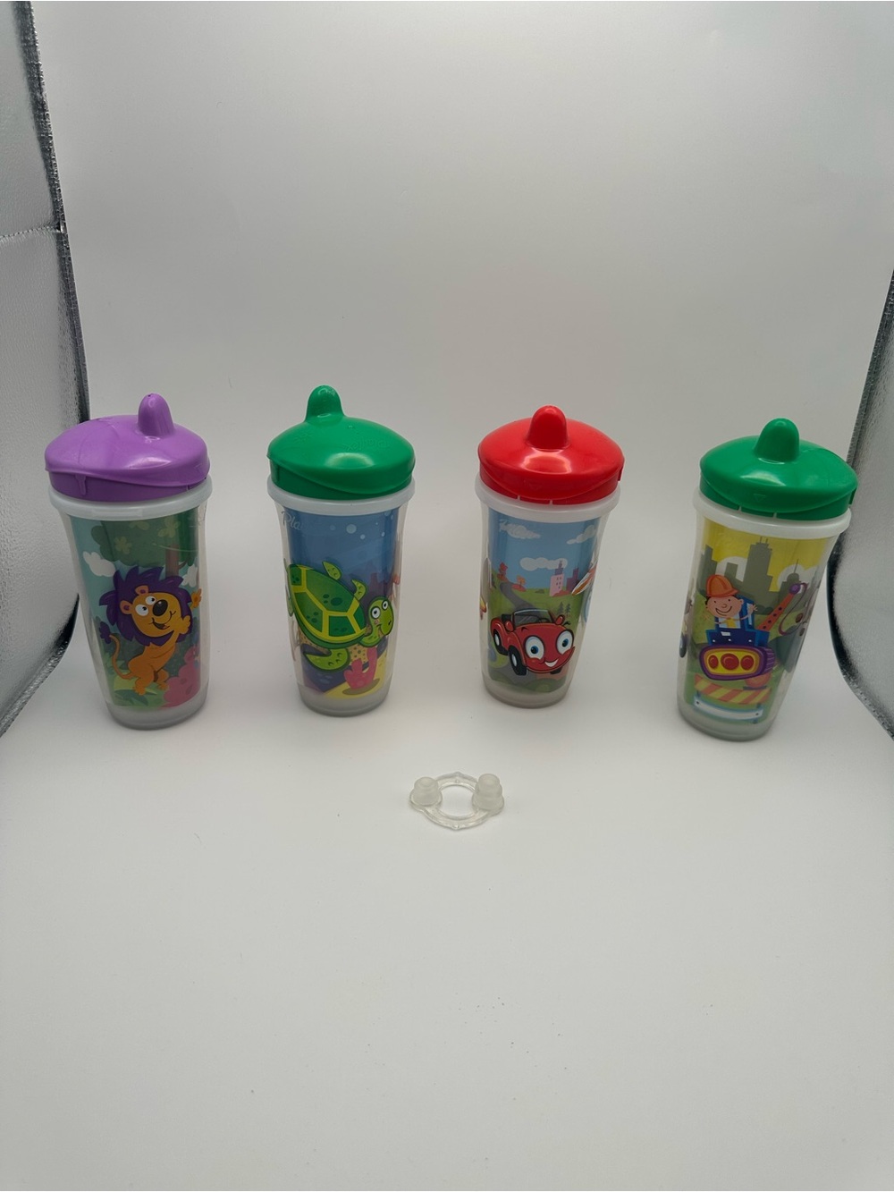 Set of four Playtex sippy cups with bonus valve